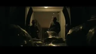 STRAW sign on dark street — John Wick