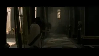 man in white robe in church-like room — Gladiator 2