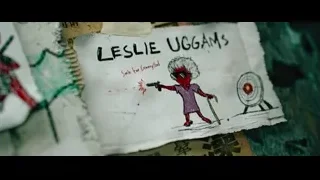 paper with "Leslie Uggam's" cartoon drawing — Deadpool 2