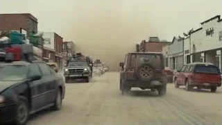 cars driving on street during dust storm — Interstellar