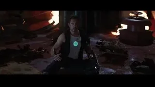 man in fiery debris-filled room — Iron Man 3