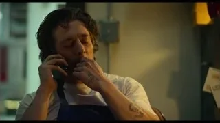 Man talking on phone in kitchen — The Bear