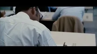 man writing at desk in classroom — The Persuit of Happyness