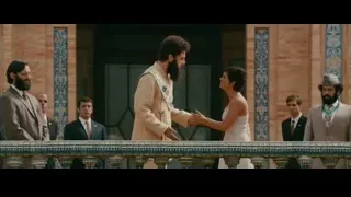 Man and woman shaking hands on balcony — The Dictator