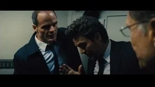 three men in suits conversing — Now You See Me