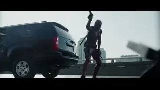 Deadpool standing on SUV holding gun — Deadpool
