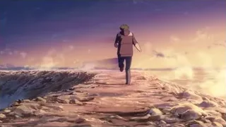 person walking on rocky cliff overlooking ocean at sunset — Your Name