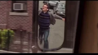 man walking on street in side view mirror — Spider Man