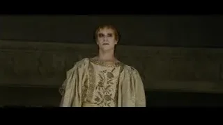 Woman looking away from man in brick room — Gladiator 2