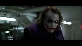 Joker holding playing card — Batman: The Dark Knight