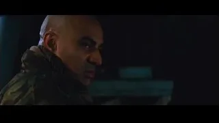two men talking in dimly lit room — Iron Man