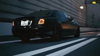 black car driving on highway at night — Sports Cars