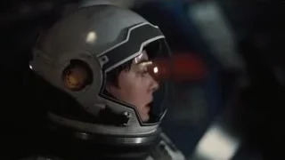 Person in helmet in dark space — Interstellar