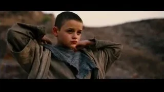 young boy in desert landscape — Batman: The Dark Knight Rises