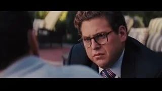 man in suit on couch talking — The Wolf Of Wall Street