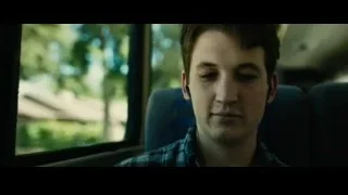 young man in plaid shirt in car — Whiplash