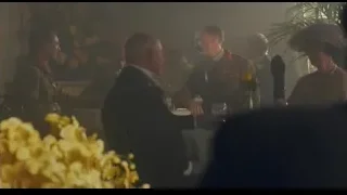 People in military uniforms conversing at table — Peaky Blinders
