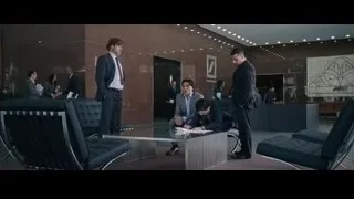 men in modern office lobby — The Big Short
