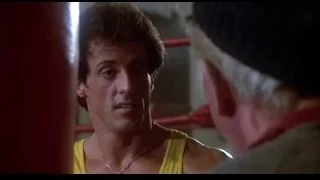 man in yellow tank top yelling — Rocky III