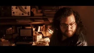 Man with curly hair and glasses close-up — Jobs