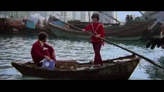 people in a small wooden boat — Bruce Lee: Enter The Dragon