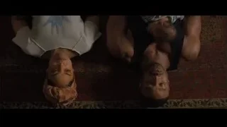 Man and woman lying on patterned rug — Creed 2
