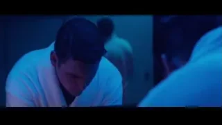 Young man in dim room with neon lights — John Wick