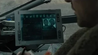 man in helicopter cockpit looking at screen — Blade Runner 2049