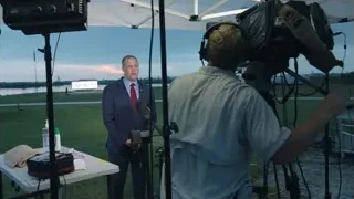 Man in suit speaking into microphone — Elon Musk: Return to Space