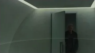 man standing in a dimly lit room — Blade Runner 2049