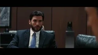 man in suit sitting in office chair — Interstellar