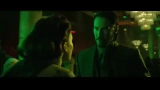 Man deep in thought in dimly lit room — John Wick