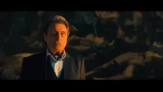 man in suit in cave-like setting — John Wick: Chapter 4