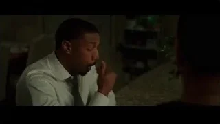 man sitting at table in dim room — Creed 3