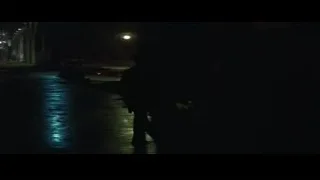 person walking on narrow street at night — Batman