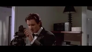 Man in suit holding assault rifle — American Psycho