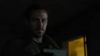 man in dark room with yellow light — Blade Runner 2049