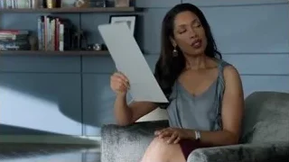 woman sitting on armchair in living room — Suits