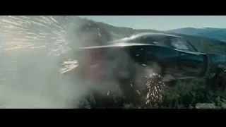 men in race car with helmets — Furious Seven