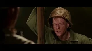 man in military uniform holding wooden pole — Hacksaw Ridge