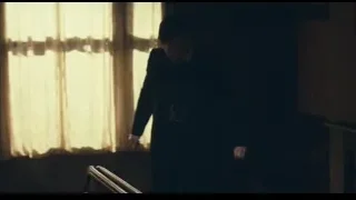 man in suit walking towards window — Peaky Blinders