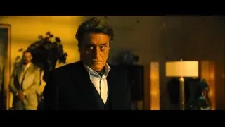 man in suit standing in dim room — John Wick: Chapter 4