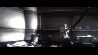Person in black suit holding robot arm and gun — Spider Man 2