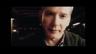 Blonde man in green jacket smiling — The Amazing Spider Man 2