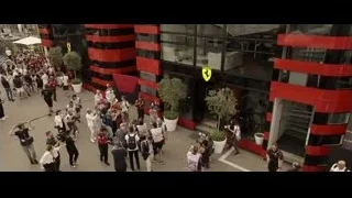 Crowd gathered in front of Ferrari building — F1