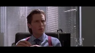 Man in office chair with hands outstretched — American Psycho