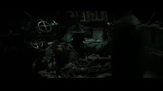 person in dark cluttered room with globe — Harry Potter and the Deathly Hallows 2