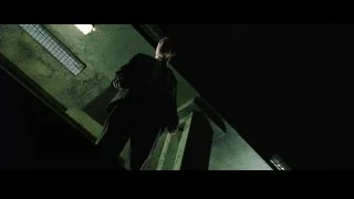 man in suit on dark staircase — The Matrix