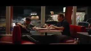 two men conversing in diner at night — Ford v Ferrari
