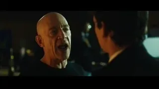 bald man talking to another man — Whiplash
